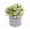 green artificial leaves plant with Cement pot